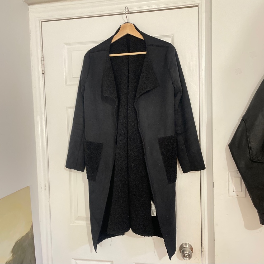 Long Black coat basement peruvian designer